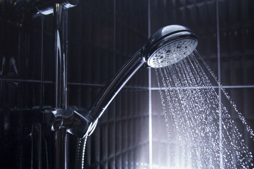 handheld shower head with running water