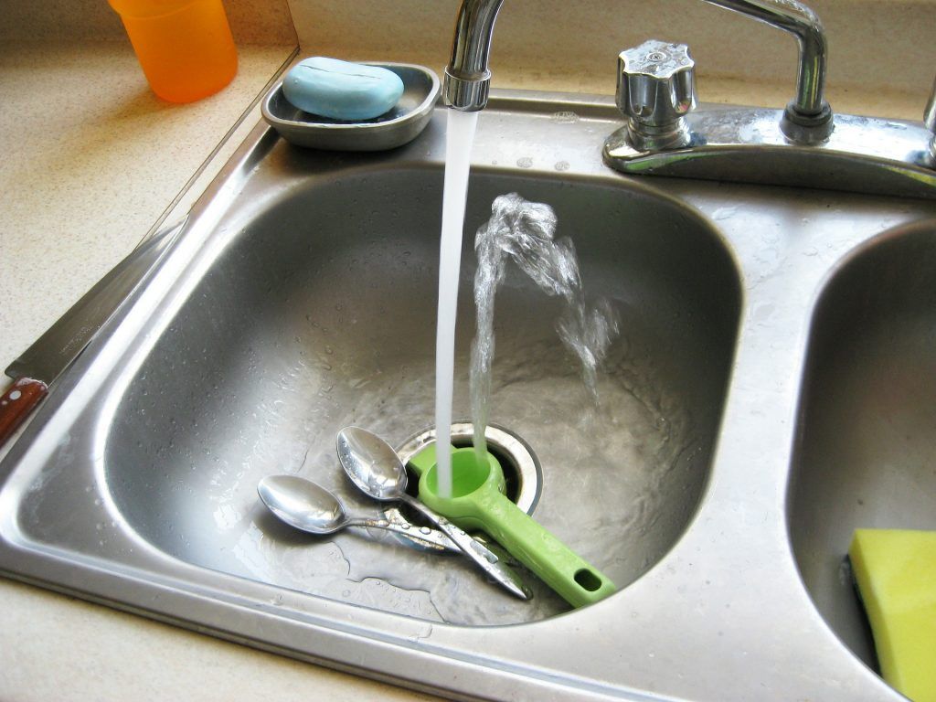 Kitchen sink with running water