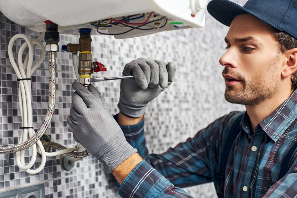 wrench-worker-plumbing-scewdriver-adjusting-1024x684