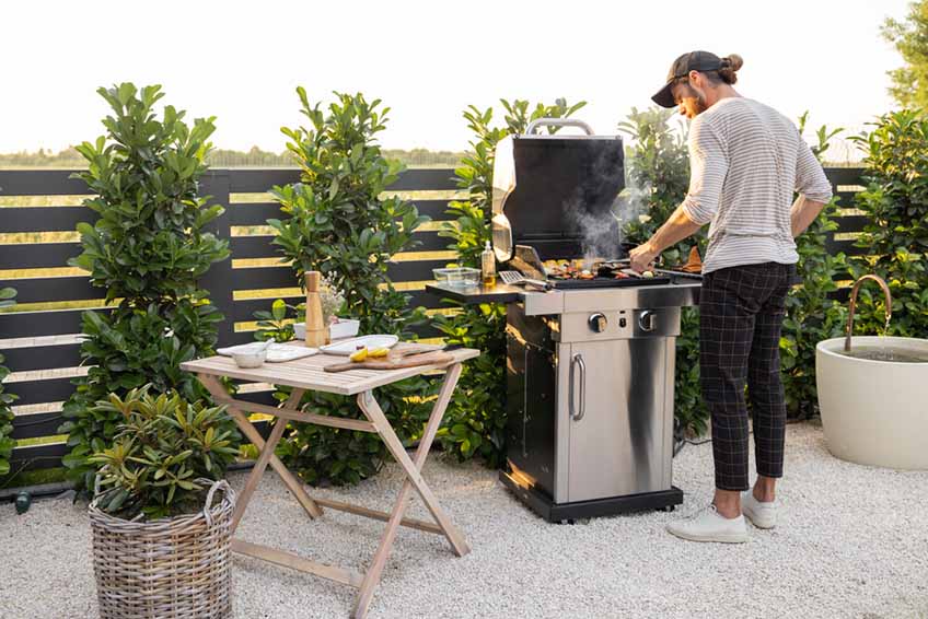 gas-powered barbecue grill in the backyard