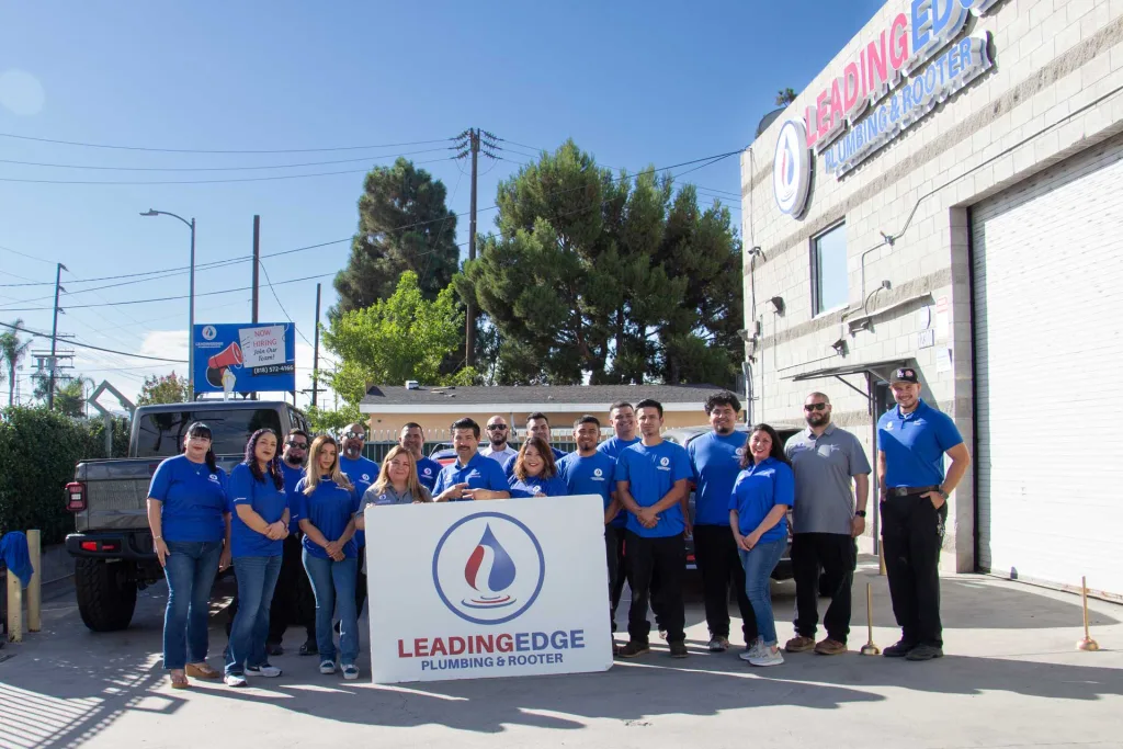 The Leading Edge Plumbing Team in front of the shop