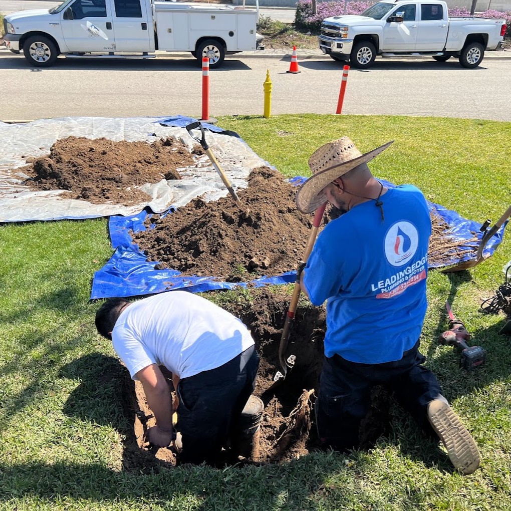 2 employees completing a trenchless pipe repair